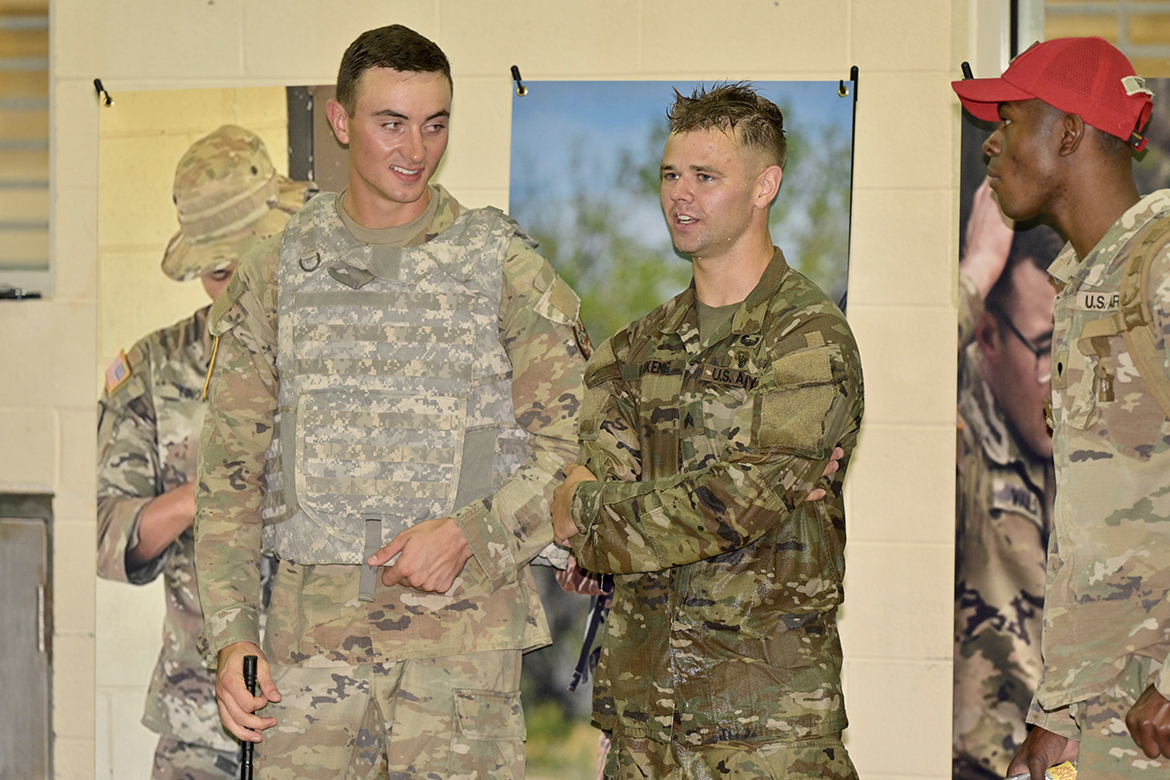 MTSU senior business finance major Cole Lukens, second from right, of Murfreesboro, the 2021 national champion, assists one of this year’s competitors during the kick off the All Guard National Best Warrior competition at the Campus Recreation Center indoor pool. Participants head to other cities to continue the July 25-29 event. (MTSU photo by Andy Heidt)
