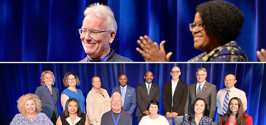 MTSU psychology professor Tom Brinthaupt, at top, smiles as his colleagues, including College of Liberal Arts Dean Leah Tolbert Lyons, right, applaud him Thursday, Aug. 18, in Tucker Theatre during the 2022 Fall Faculty Meeting. Brinthaupt received the MTSU Foundation's Career Achievement Award, the university's highest faculty honor, at the event, which precedes the first day of classes for each new academic year. In the photo below, Brinthaupt is joined by ten more MTSU professors who also received awards from the MTSU Foundation for their accomplishments in and outside the classroom, along with university President Sidney A. McPhee, alumnus and MTSU Foundation President Ronald Roberts and University Provost Mark Byrnes. (MTSU photos by Andy Heidt)