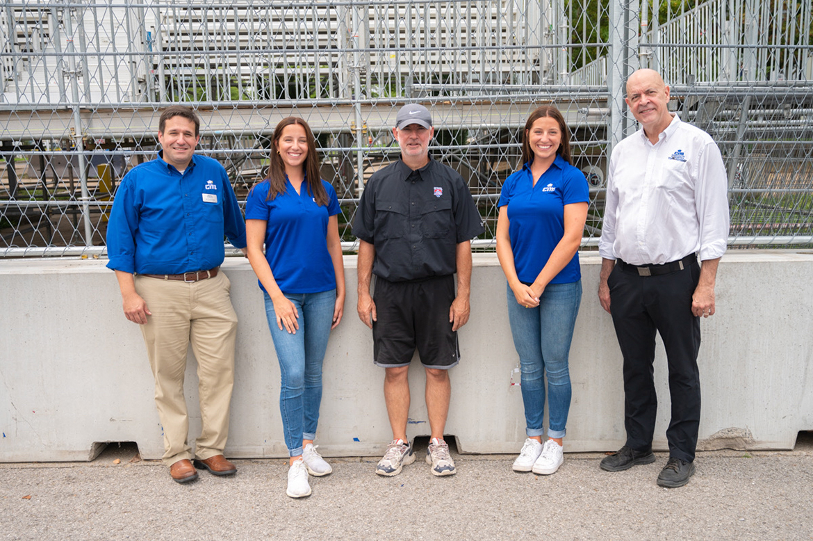 MTSU’s Concrete Industry Management program visits with Music City Grand Prix track designer Tony Cotman, center, Monday, Aug. 1, outside Nissan Stadium in Nashville. The CIM group includes Jon Huddleston, left, clinical associate professor and CIM director; identical twins and MTSU students Kayla and Ashley Gates; and Kelly Strong, School of Concrete and Construction Management director. The Gates will talk about the program and their NASA research at the track Friday, Aug. 5. (MTSU photo by J.ames Cessna)