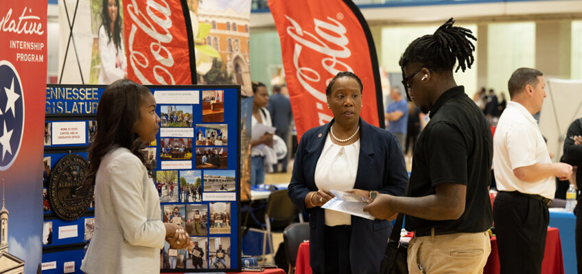 Representatives from the Coca-Cola company speak with a student during the 2022 Fall Career Fair held Sept. 29 in the Campus Recreation Center. (MTSU photo by James Cessna)