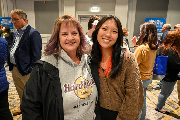 Keviyah Endsley, senior at Siegel High School in Murfreesboro, Tenn., right, visits the Middle Tennessee State University True Blue Tour event at the Cool Springs Marriott in Franklin, Tenn., on Monday, Nov. 14, 2022, with her mom, Natasha Endsley, and talks with MTSU advisors to learn about biology programs. (MTSU photo by Stephanie Wagner)