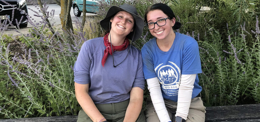 Audrey Lauerhass, Middle Tennessee State University forensic science and anthropology student, left, poses with MTSU student Tori Bascou, both in their field clothes after a long day of work on a recovery site in France as part of the MTSU Forensic Aviation Archaeology study abroad course in summer 2022. (Photo courtesy of Audrey Lauerhass)