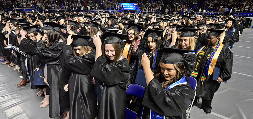 Members of Middle Tennessee State University's fall Class of 2022 prepare to move their mortarboard tassels from right to left to signify their successful graduation during the university's Dec. 10 commencement ceremonies in Hale/Earle Arena inside Murphy Center. MTSU will award degrees to 2,658 prospective graduates during four spring 2023 commencement ceremonies planned over Friday and Saturday, May 5-6. (MTSU file photo by Andy Heidt)