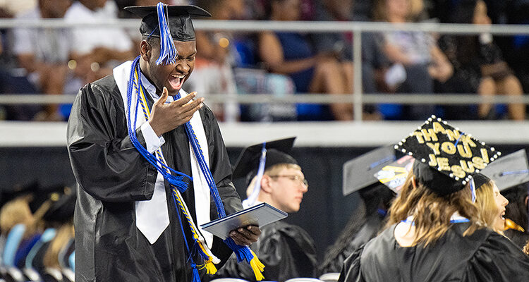 A member of Middle Tennessee State University's Class of 2023 shouts with joy and relief May 6 as he returns to his seat with his new degree inside Murphy Center during MTSU's spring commencement ceremonies. The university presented more than 2,650 undergrad and graduate degrees to students in four ceremonies held May 5-6. (MTSU file photo by Cat Curtis Murphy)