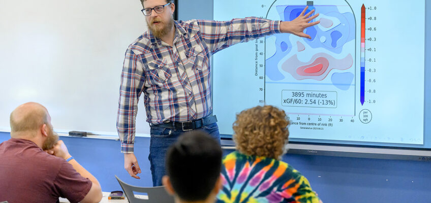 Micah McCurdy, a Canadian university adjunct math professor, explains the decrease in the Nashville Predators 5-on-5 offensive production during the 2022-23 NHL season to Middle Tennessee State University students, faculty and administrators attending his Wednesday, June 28, talk in a Kirksey Old Main classroom. Primarily in a networking role with friends, fans and media, McCurdy was in Nashville, Tenn., June 28-29 for the 2023 NHL Entry Draft in Bridgestone Arena. (MTSU photo by J. Intintoli)