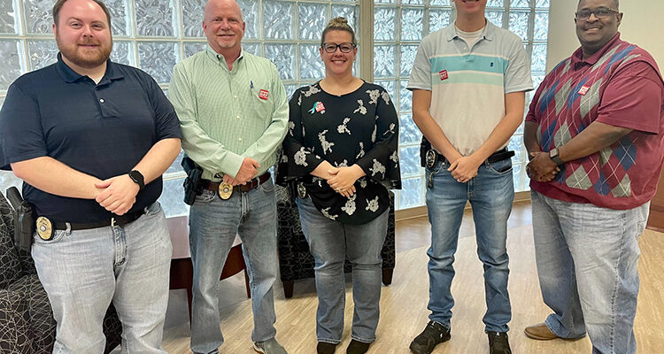 Middle Tennessee State University Police Detective Tommy Roberts, second from left, who specializes in investigating domestic violence and sexual assault, takes a photo April 26, 2023, with MTSU’s detective team on “Denim Day,” a campaign to raise awareness about the prevalence and misconceptions of sexual assault. Standing, from left, are Detective Trevor Chaney, Roberts, Detective Lt. Kim Rednour, Detective Lt. Andrew Bennet and Detective Derrick Wharton. (Submitted photo)