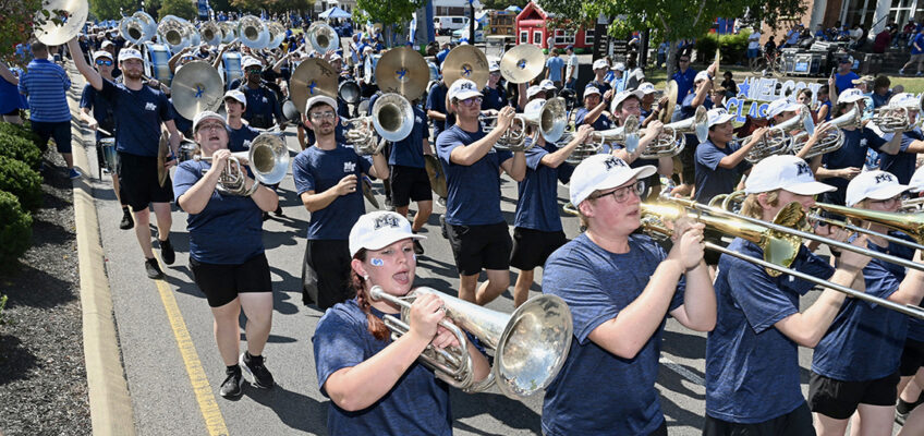 Middle Tennessee State University’s Band of Blue entertains spectators along Middle Tennessee Boulevard in Murfreesboro, Tenn., in September 2023 during the MTSU Homecoming Parade. The band again will perform Saturday, Sept. 21, at the parade, Raider Walk and throughout the game between the Blue Raiders and visiting Duke Blue Devils from the Atlantic Coast Conference. (MTSU file photo by J. Intintoli)
