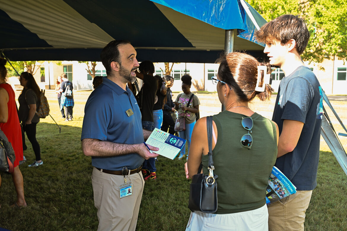 John Davis, left, assistant director of undergraduate transmission admissions at Middle Tennessee State University, chats with a prospective student and his mother Sept. 30 in the Student Union Commons during the first of two MTSU True Blue Preview Days. MTSU holds is final preview day starting at 9 a.m. Saturday, Nov. 4, in the Student Union Building. (MTSU file photo by James Cessna)