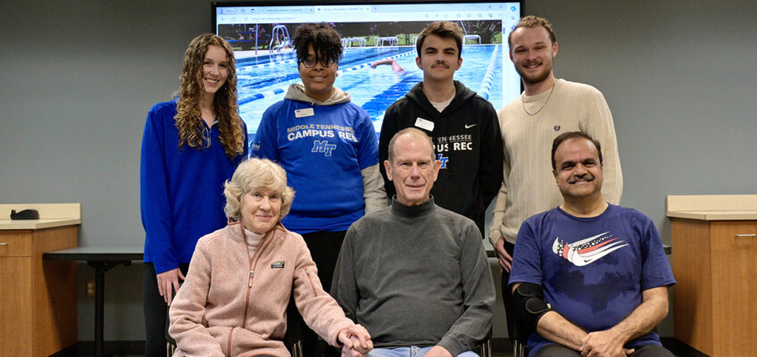 Retired Middle Tennessee State University professor and Computer Science Department Chair Richard Detmer, seated center, and his wife, Carol, seated left, visit with four MTSU Recreation Center student workers, standing, who helped save his life when he experienced cardiac arrest while playing racquetball Jan. 19 with marketing professor Raj Srivastava, seated right. The students, from left, are Julia Rutledge, Jasmine Jackson, Andrew Scrugham and Gatlin Murr. Now recovered, Detmer, 78, and his wife brought cookies Feb. 9 to thank the students and MTSU Campus Police for their life-saving responses. The students had received American Red Cross training to use CPR and AED equipment. (MTSU photo by Andy Heidt)