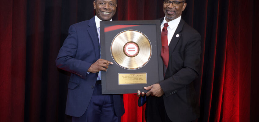 Middle Tennessee State University President Sidney A. McPhee, left, receives a framed thank you gift from Urban League of Middle Tennessee President and CEO Clifton E. Harris after giving keynote remarks at the civil rights organization’s 56th “Equal Opportunity Day” luncheon held Feb. 22 at the Music City Center in Nashville, Tenn. (Photo by Emanuel O. Roland II)