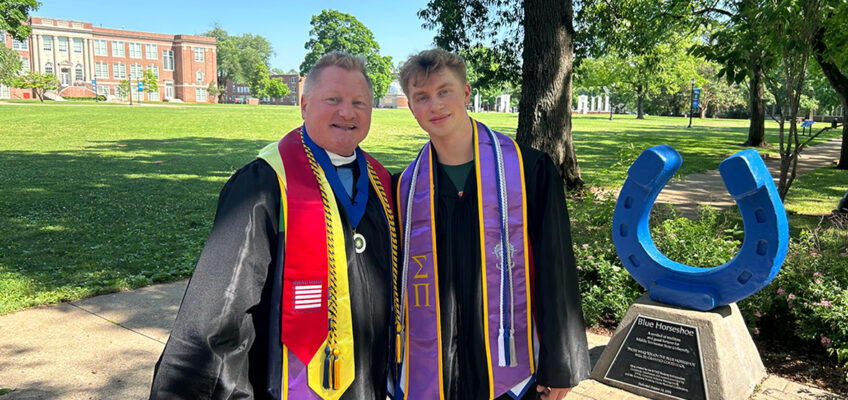 Shown here at Middle Tennessee State University’s Walnut Grove in their academic regalia, School of Journalism and Strategic Media instructor Dan Eschenfelder and his son Cameron graduated with their degrees one day apart during MTSU’s Spring 2024 commencement May 3-4. Dan earned his master’s in liberal arts and Cameron earned his bachelor’s in geosciences. (Photo courtesy of Dan Eschenfelder)
