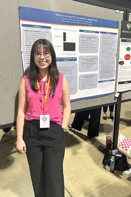 Hannah Antrican, an undergraduate researcher from Middle Tennessee State University, stands next to the poster display of her research project about the impacts of eco-anxiety about climate change on the correlation to pro-environment behavior that she presented at the National Conference for Undergraduate Research at the Long Beach Convention Center in Long Beach, Calif., in April 2024. (Submitted photo).
