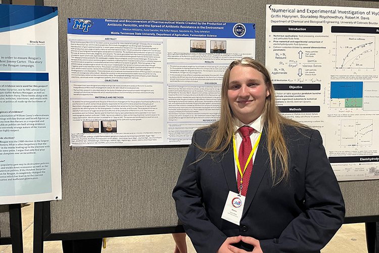 Weston Williams, an undergraduate researcher from Middle Tennessee State University, stands next to the poster display for his project about the potential effects of penicillin production byproducts on the environment that he presented at the National Conference for Undergraduate Research at the Long Beach Convention Center in Long Beach, Calif., in April 2024. (Submitted photo).