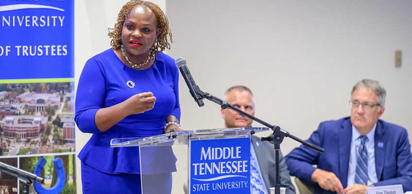 With Vice President of Business and Finance Alan Thomas, second from left, and Provost Mark Byrnes looking on, Khalilah Doss, left, addresses members of the Middle Tennessee State University Board of Trustees in early June following her appointment as vice president of student affairs and dean of students during their meeting at the Miller Education Center on Bell Street in Murfreesboro, Tenn. Doss, a Kingston, Jamaica, native who came to MTSU from the University of Southern Indiana in Evansville, was recommended to the board by university President Sidney A. McPhee. (MTSU photo by J. Intintoli)