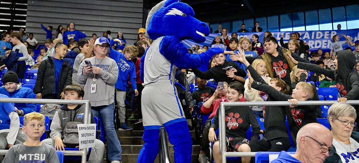 Blue Raider mascot Lightning gets youngsters from one of Murfreesboro City elementary schools fired up during the annual Education Day game Wednesday, Dec. 4, in Murphy Center on the Middle Tennessee State University campus in Murfreesboro, Tenn. (MTSU photo by Andy Heidt)