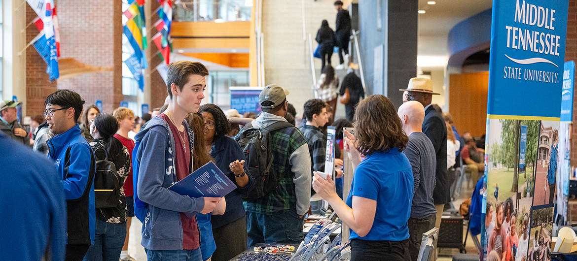 One of hundreds visiting during a fall True Blue Preview Day event in September 2024, a prospective Middle Tennessee State University student learns more about the College of Liberal Arts in the Student Union atrium on campus in Murfreesboro, Tenn. Hundreds of high school and transfer students and their families will be visiting MTSU for Feb. 8 and March 22 preview day events, and have an opportunity to apply for free on those two days, both Saturdays. (MTSU photo by Cat Curtis Murphy)