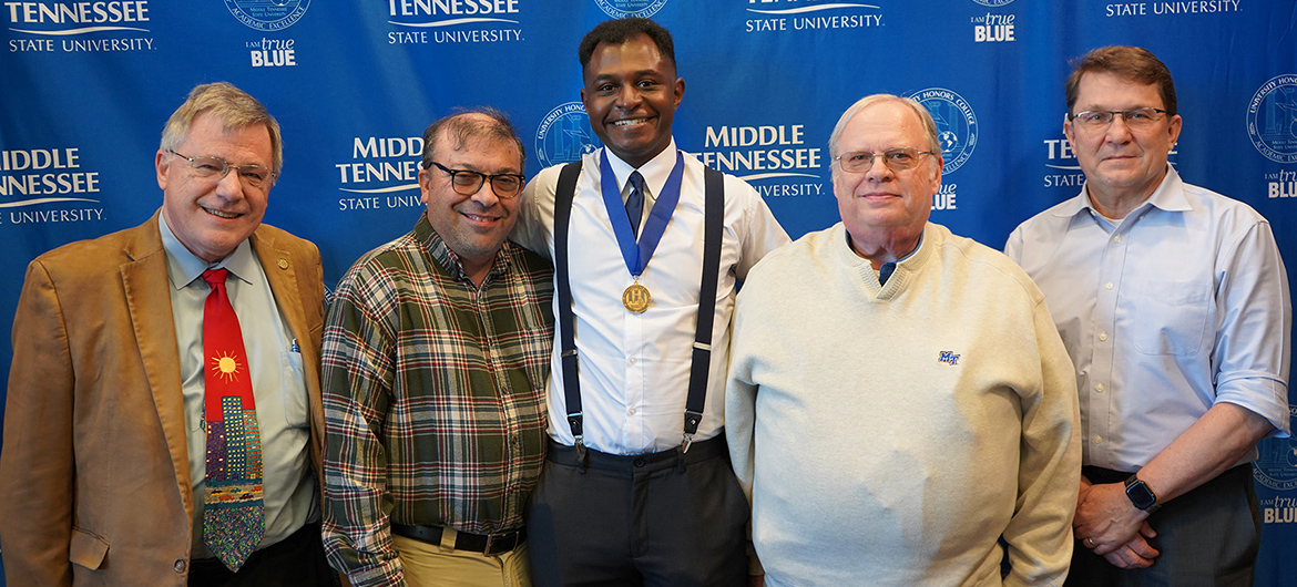 From left, Middle Tennessee State University Honors College Dean John Vile, biology professor Anthony Farone, senior biology major Rashieq Cockerham, chemistry professor Paul Kline, and Chemistry Department Chair Richard Nagorski take a group photo following Cockerham’s successful defense of his Honors thesis in the fall on campus in Murfreesboro, Tenn. (MTSU photo by Connie Bartemus)