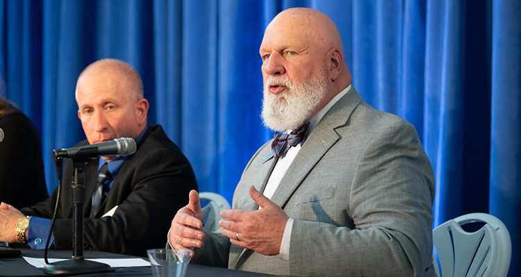 Thom Coats, right, professor of practice and director for the MTSU Center for Professional Selling at Middle Tennessee State University, gives remarks during a panel of university center directors at the 2025 Tech Vision Conference held April 10-11 in the Miller Education Center atrium on Bell Street on the MTSU campus in Murfreesboro, Tenn. At left is fellow panelist Richard Tarpey, director, Center for Supply Chain Management and Sustainability. (MTSU photo by James Cessna)