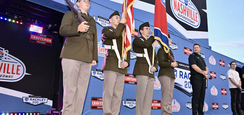 Members of the U.S. Army ROTC color guard from Middle Tennessee State University in Murfreesboro, Tenn., present the colors May 30 before the Rackley Roofing 200 at Nashville Superspeedway in Lebanon, Tenn. (MTSU photo by James Cessna)