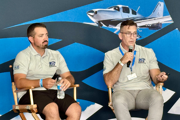 Nate Callender, right, MTSU Aerospace Department associate chair and professor, and professor Collin McDonald, left, give a special presentation hosted by the Aircraft Owners and Pilots Association, “Maximizing Engine-Out Glide Performance,” during the 72nd EAA AirVenture aviation showcase held July 21-27 in Oshkosh, Wis. Their presentation was based on a 2023 paper that Callender wrote for Collegiate Aviation Review International, published by the University Aviation Association. (MTSU photo by Mark Byrnes)
