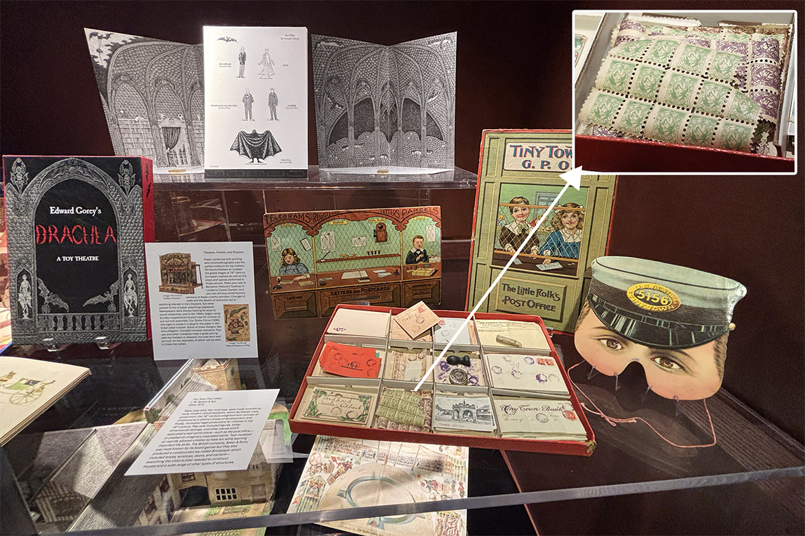 James E. Walker Library Special Collections exhibit, “Playful Paper,” features printed paper toys like this post office game that includes tiny stamps (see inset) and greeting cards. Other items on display include sets in pop-up book form, like “Dracula.” (MTSU photo by Nancy DeGennaro)