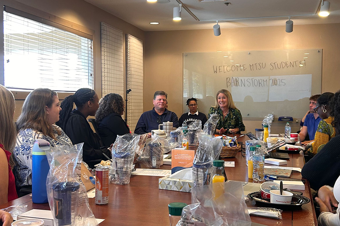  Jarrard Inc. President Anne Hancock Toomey, speaking at head of table, and Kevin Phillips, chief operating officer, left at head of table, shared insights with 11 Middle Tennessee State University School of Journalism and Strategic Media students at the Nashville-based strategic communications firm where students had the opportunity to experience fast-paced learning firsthand that’s focused on real-world crisis communication challenges in the health care industry.  (Photo submitted)