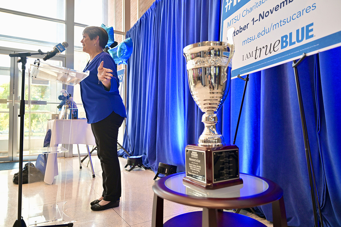 Middle Tennessee State University’s Joyce Heames, dean of the Jennings A. Jones College of Business, shares how nonprofits like United Way helped her earlier in life during the kickoff of the 2025-26 Employee Charitable Giving Campaign on Wednesday, Sept. 24, in the Cope Administration Building atrium in Murfreesboro, Tenn. Heames relinquished the Provost’s Cup, at right, which the Jones College has won for 13 straight years for having the most participation among the academic colleges. (MTSU photo by J. Intintoli)