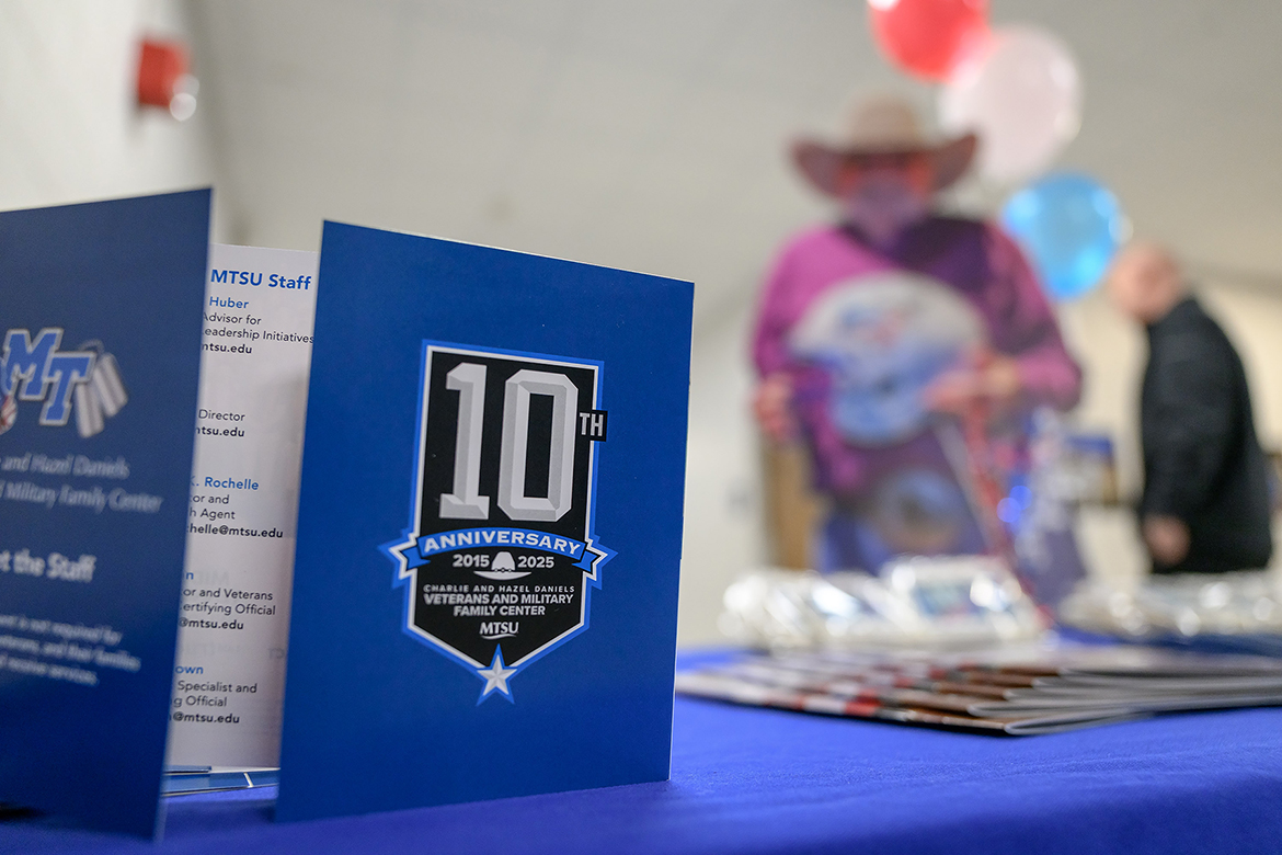 With a life-size cardboard cutout of the late country music icon Charlie Daniels in the background, a “Meet the Staff” card and magazines promoting the Middle Tennessee State University Charlie and Hazel Daniels Veterans and Military Family Center sit on a table display outside the Keathley University Center Theater on Monday, Nov. 3, on campus in Murfreesboro, Tenn. (MTSU photo by J. Intintoli)