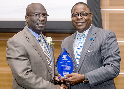 Former Murfreesboro Fire and Rescue Department Chief Cumbey Gaines, left, accepts the 2016 Unity Luncheon's Trailblazer Award from MTSU President Sidney A. McPhee during the Feb. 18 luncehon in the Student Union Ballroom. Gaines, the first African-American to hold that position, received a special Trailblazer Award. Gaines, who retired in 2015, served the city for 35 years and was the department’s first African-American inspector, shift commander and deputy chief.
