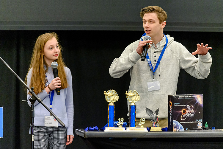 New Jersey sibling inventor-entrepreneurs Heidi, left, and Joey Hudicka encourage local fourth-, fifth- and sixth-graders attending MTSU's 27th annual Invention Convention, held Feb. 21 in the university's Student Union Ballroom, to "make that leap" to share their ideas with the world. Nearly 800 Midstate youngsters attended this year's event, displaying a total of 375 inventions. (MTSU photo by J. Intintoli)