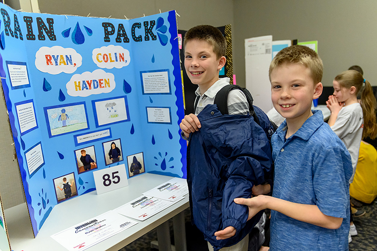 Murfreesboro sixth-graders Brianna Guthrie, left, and Abby Gibbs of Northfield Elementary School have the solution to "Make Life Easier" after Middle Tennessee's weeks of soggy weather: "The Rain Stopper," their creation for MTSU's 27th annual Invention Convention, held Feb. 21 in the university's Student Union Ballroom. The duo was among nearly 800 Midstate youngsters attending this year's event, displaying a total of 375 inventions. (MTSU photo by J. Intintoli)
