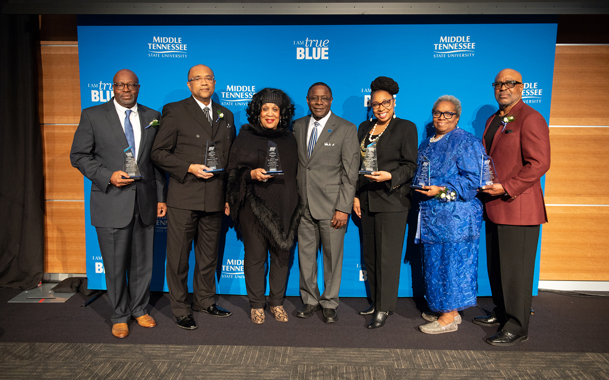 Shown with MTSU President Sidney A. McPhee, center, 2020 Unity Luncheon honorees include Ray Bonner, left, Marcus Lucas Sr., Phyllis Adams, Valerie Whitlow (accepted for the late Leonora “Ms. Boe” Washington and Ed Miller. The event was held Thursday, Feb. 20, in the MTSU Student Union Ballroom. (MTSU photo by James Cessna)