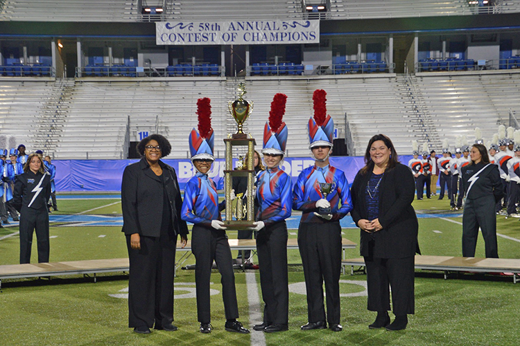 The Bartlett High School Marching Band of Bartlett, Tenn., took home honorable mention honors for their performance at the 58th Contest of Champions held Saturday, Oct. 23, at Floyd Stadium. Presenting the band with their awards are, far left, Leah Lyons, interim dean of the MTSU College of Liberal Arts, and far right, Jennifer Vannatta-Hall, interim director of the MTSU School of Music. (Submitted photo)