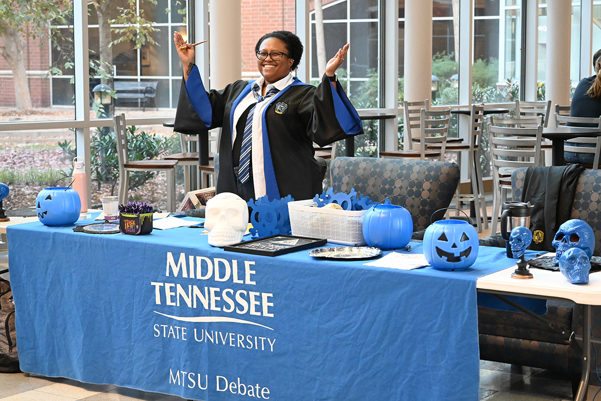 Blue Raider Debate Team assistant coach Natonya Listach, a communication studies master instructor, is all smiles as she welcomes attendees to the MTSU-hosted Naveen “Scott” Pajaver Memorial Debate Tournament held in late October at the Business and Aerospace Building on the Middle Tennessee State University campus. (MTSU photo by Jimmy Hart)