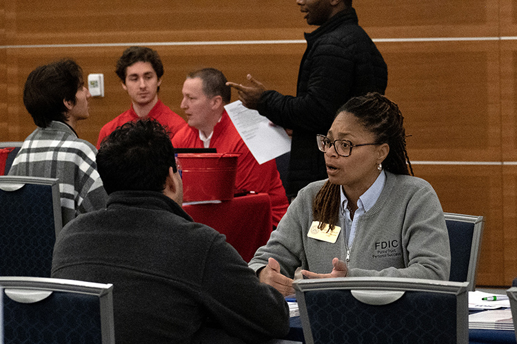 A representative with the Federal Deposit Insurance Corp., right, speaks with an MTSU student Tuesday, March 21, during the 2023 Business Exchange for Student Talent, or BEST, Career Fair inside the Student Union Ballroom. (MTSU photo by Darby Campbell-Firkus)