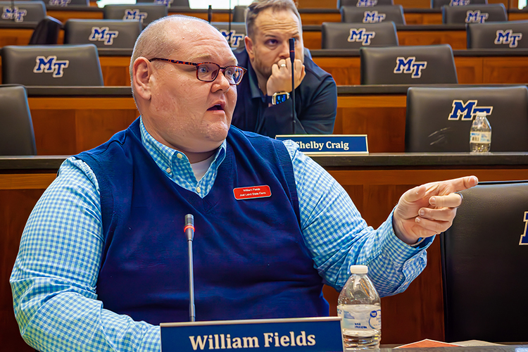 MTSU Business Plan Competition Finals judge William Fields with State Farm Insurance asks a question during the 2023 finals presentations April 26 in the Student Union Parliamentary Room at Middle Tennessee State University. Behind him is fellow judge Shelby Craig, owner of Rocket Shirts. (MTSU photo by Tom Beckwith)