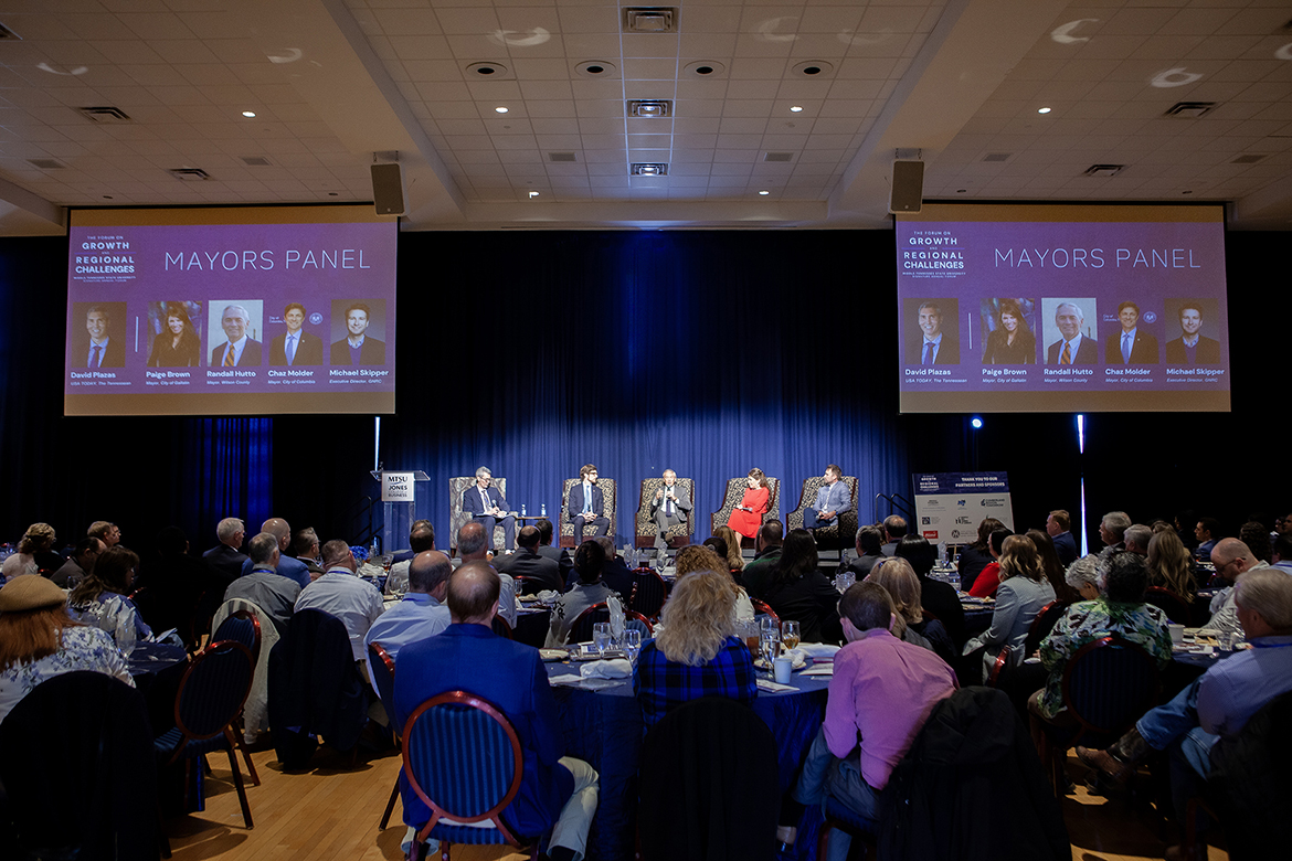 Hundreds of attendees listen as area mayors discuss issues surrounding the region’s rapid growth Friday, March 21, during Middle Tennessee State University’s annual Forum on Growth and Regional Challenges inside the James Union Building Tennessee Ballroom on campus in Murfreesboro, Tenn. The panel featured, on stage from left, Tennessean columnist David Plazas, moderator; Columbia Mayor Chaz Molder; Wilson County Mayor Randall Hutton; Gallatin Mayor Paige Brown; and Michael Skipper, executive director of the Greater Nashville Regional Council. (MTSU photo by Tom Beckwith)
