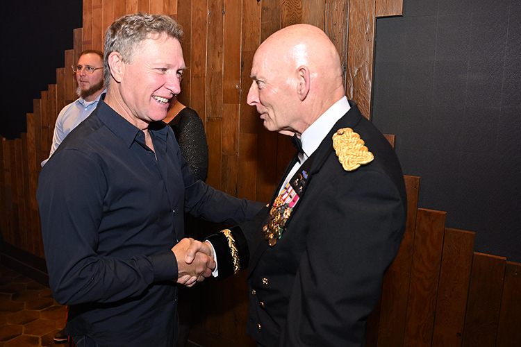 Retired Army Lt. Gen. Keith Huber, senior adviser for veterans and leadership initiatives at Middle Tennessee State University in Murfreesboro, Tenn., right, and country music artist and MTSU alumnus Craig Morgan greet each other Tuesday, May 20, at the Grand Ole Opry’s annual Salute the Troops celebration in Nashville, Tenn., that also included observance of the 250th birthday of the U.S. Army. Huber and Army Maj. Gen. Brett Sylvia, commander of the 101st Airborne Division at Fort Campbell, Ky., helped welcome Morgan and country music stars and Opry members Steven Curtis Chapman, Sal Gonzalez and more, along with the 100th Army Band. (MTSU photo by James Cessna)