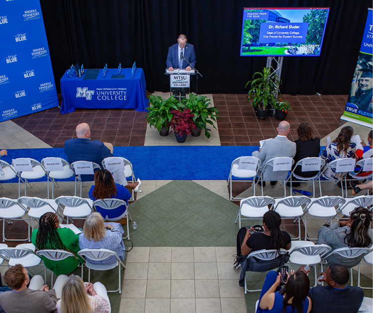 Rick Sluder, at lectern, dean of the University College and vice provost for student success at Middle Tennessee State University, opens the college’s awards ceremony held May 1 in the atrium of the Miller Education Center on Bell Street in Murfreesboro, Tenn. (MTSU photo by Tom Beckwith)
