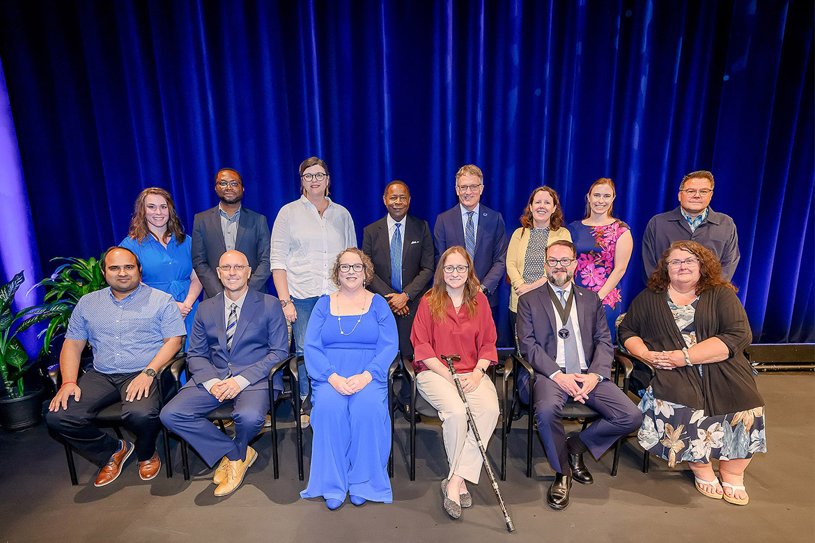 Middle Tennessee State University President Sidney A. McPhee, back row center, poses with recipients of the President’s Silver Column Award after the annual Fall Faculty and Staff Meeting held Thursday, Aug. 21, in Tucker Theatre on campus in Murfreesboro, Tenn. Pictured, front row, from left, are Souvik Banerjee, Distinguished Early Career Research Award; Gregory T. Rushton, Distinguished Senior Research Award; Joyce Anne Finch, Distinguished Early Career Creative Activity Award; Jessica Arbour, Outstanding Public Service Award; Philip E. Phillips, Career Achievement Award; and Maria Edlin King, Outstanding Public Service Award; and back row, from left, C. Rebecca Oldham, Outstanding Teaching Award; Samuel Haruna, Outstanding Teaching Award; Kate Goodwin, Outstanding Teaching Award; MTSU President Sidney A. McPhee; MTSU Provost Mark Byrnes; Emily Baran, Outstanding Public Service Award; Ashley Valanzola, Outstanding Teaching in True Blue Core Award; and Fred Arroyo, Distinguished Senior Career Creative Activity Award. Gaia Rancati, Distinguished Early Career Research Award recipient, was unable to attend. (MTSU photo by Andy Heidt)