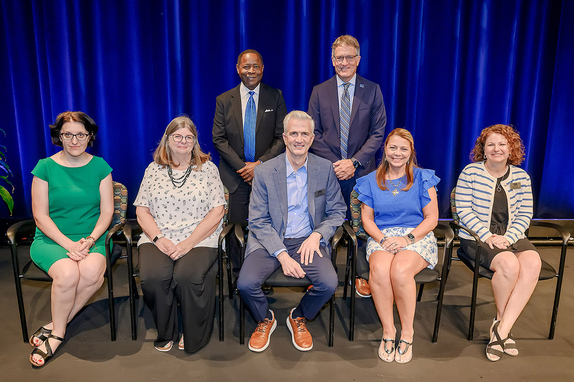 Middle Tennessee State University President Sidney A. McPhee, back row center, poses with recipients of the 2025 President’s Silver Column Award after the annual Fall Faculty and Staff Meeting held Thursday, Aug. 21, in Tucker Theatre on campus in Murfreesboro, Tenn. Pictured, front row, from left, are Hanna Terletska, associate professor of physics and astronomy; Brenda Wunder, manager of Facilities Services; Jeff Gibson, professor and associate dean of the College of Liberal Arts; Gina Poff, director of New Student and Family Programs; and Meredith Kerr, development director in the College of Liberal Arts. (MTSU photo by Andy Heidt)