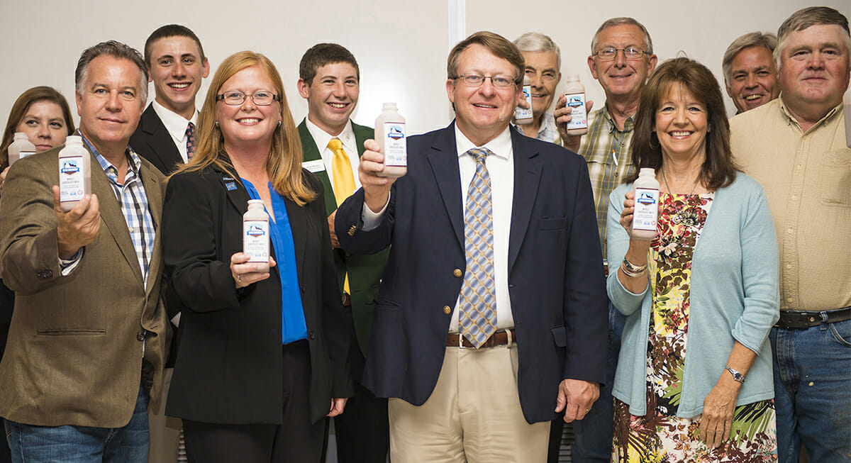 Attendees "toast" the Tennessee Milk logo announcement for MTSU