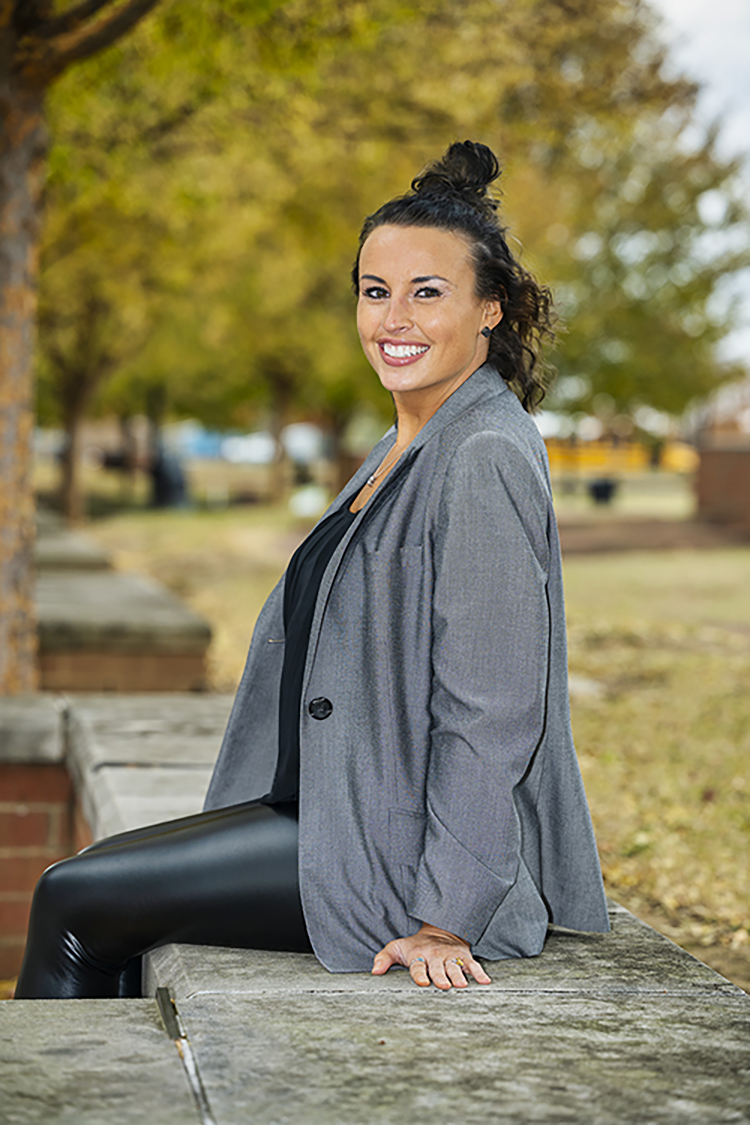 Alicia Abney, advising manager for MTSU's College of Education, is the recipient of the Woman of Achievement Award from Women in Higher Education in Tennessee. She is seen here outside the College of Education building. (MTSU photo by Andy Heidt)