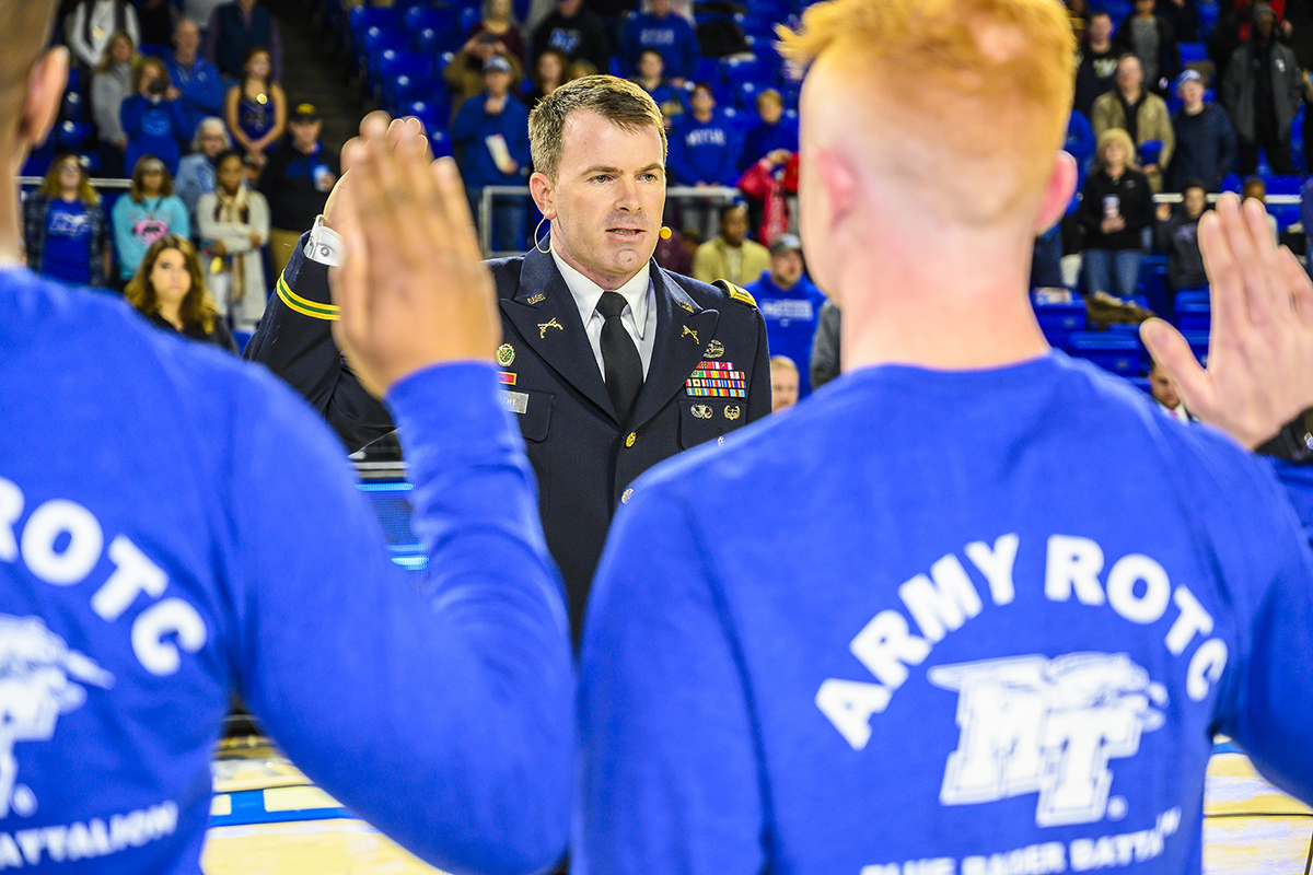 U.S. Army Lt. Col. Carrick McCarthy, center, administers the Army oath, to new MTSU ROTC students in January 2019 as part of the first Blue Raider Veteran and Military Appreciation Night in January 2019. This year’s veterans game will be at 6:30 p.m. Thursday, Jan 30, in Murphy Center. (MTSU file photo by Eric Sutton)