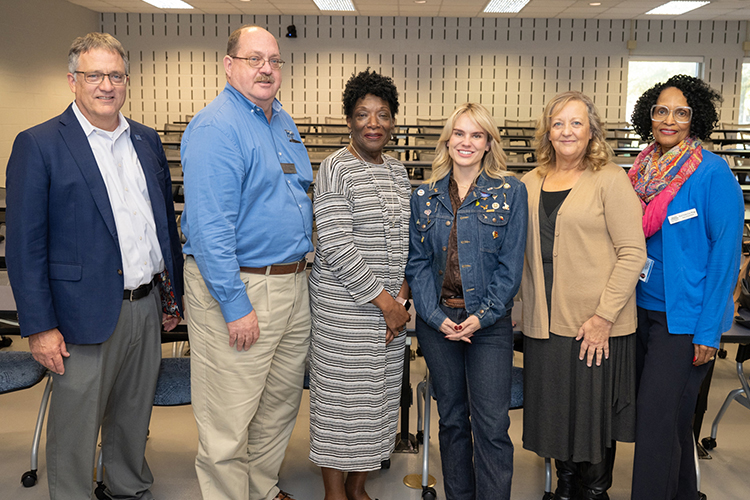 State Rep. Aftyn Behn, center, stands with Middle Tennessee State University faculty and administration after her Nov. 2 talk, from left, MTSU Provost Mark Byrnes; Michael Hein, College of Behavioral and Health Sciences interim dean; Cathy McElderry, Department of Social Work chair; Behn; Vickie Harden, associate professor of social work; and Violet Cox-Wingo, lecturer. (MTSU photo by James Cessna)
