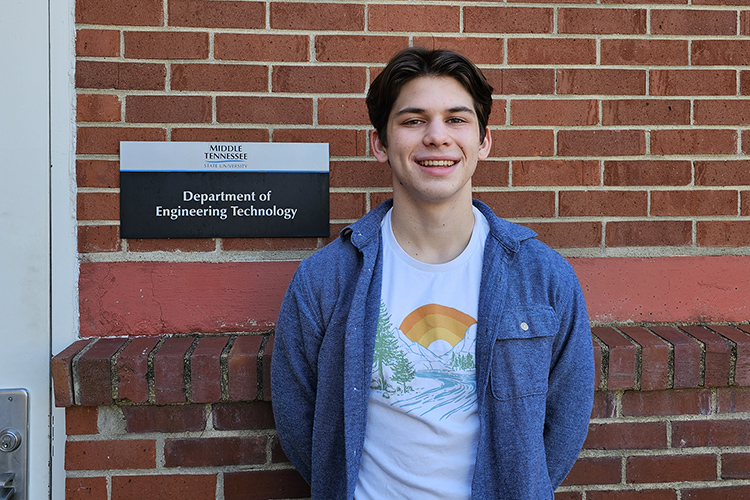 Shown here earlier this semester outside a Voorhees Engineering Technology laboratory on the Middle Tennessee State University campus, junior mechatronics engineering major Samuel Apigian of Murfreesboro, Tenn., is heading to Technische Universität Dresden in Germany this summer after being awarded the prestigious Deutscher Akademischer Austauschdienst Research Internship in Science and Engineering, better known as the DAAD RISE scholarship. (MTSU photo by Robin E. Lee)