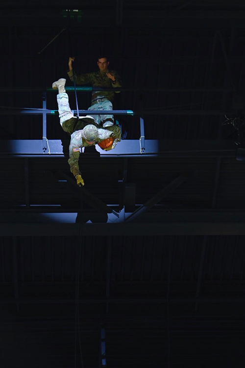 A member of the U.S. Army’s 101st Airborne Division rappels from the rafters of Murphy Center Jan. 30 to deliver the game ball as part of MTSU Women’s Basketball’s veteran appreciation night. (MTSU photo by Cat Curtis Murphy)