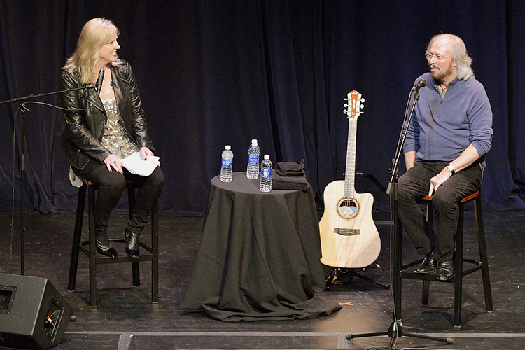 Music icon Barry Gibb, right, is caught off-guard by a question from Beverly Keel, chair of MTSU's Department of Recording Industry, during a special performance-lecture inside the university's Tucker Theatre Monday, Oct. 28. (MTSU photos by Andy Heidt)