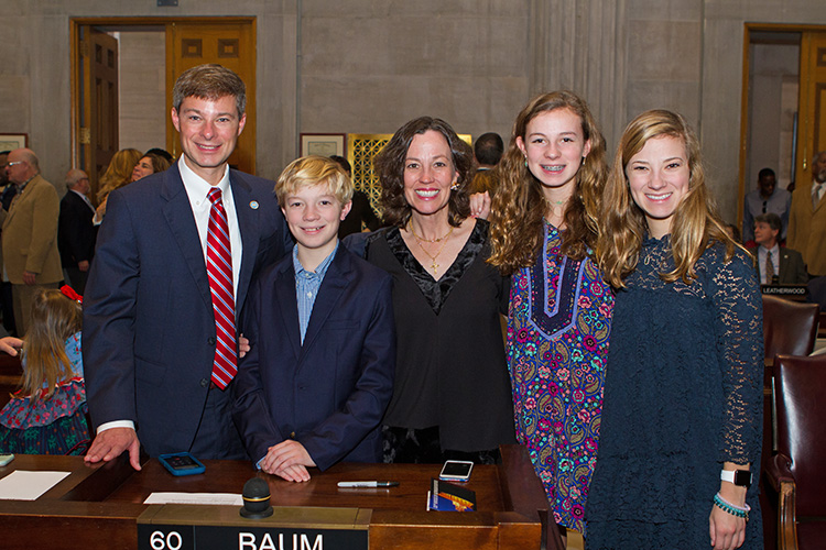 Charles Baum, left, a professor in the Jones College of Business, MTSU, was sworn in Tuesday, Jan. 8, as a state representative for Murfreesboro's 37th District. Pictured with him, from left, at the state Capitol in Nashville, are son Charles, wife Kelly, and daughters, Anna Jane and Elizabeth. (MTSU photo by James Cessna)
