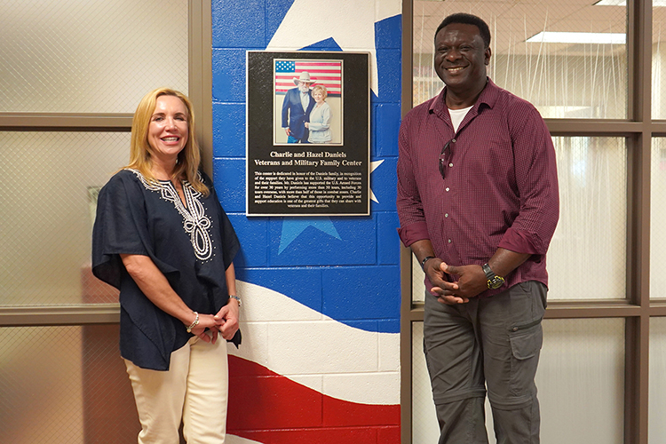 From left, Hilary Miller, director of the Charlie and Hazel Daniels Veterans and Military Family Center, and U.S. Navy veteran and rising senior concrete industry management major Bennie Thompson of Fayetteville, Tenn., are shown outside the center entrance inside Keathley University Center on the campus of Middle Tennessee State University. (MTSU photo by Robin E. Lee)